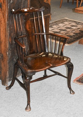 Lot 1402 - A George II Style Elm Comb Back Windsor Chair,...