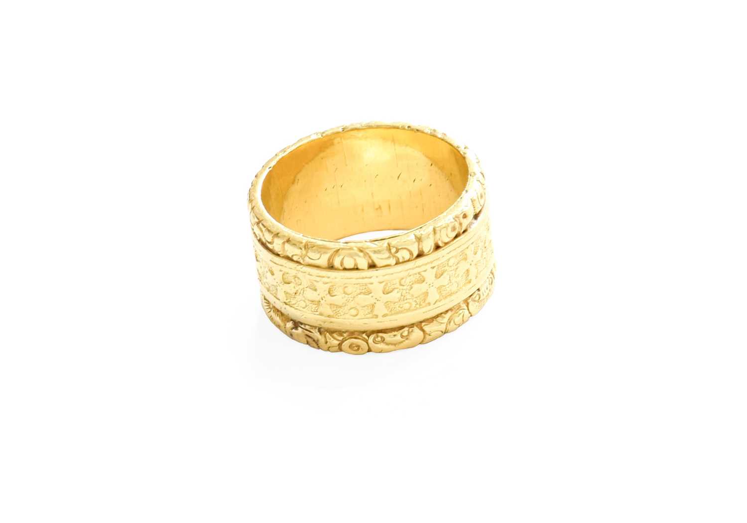 Lot 12 - An 18 Carat Gold Band Ring, decorated with...