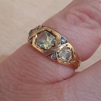 Lot 2155 - An 18 Carat Gold Chrysoberyl and Diamond Ring...
