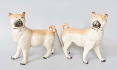 Lot 215 - A Pair of Staffordshire Pottery Pugs, each...