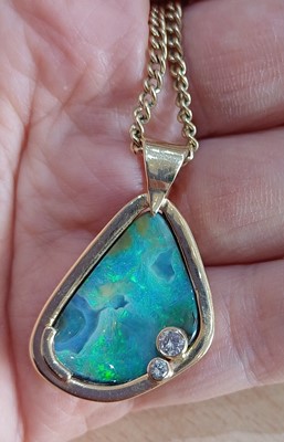 Lot 2078 - An Opal and Diamond Pendant on Chain the...