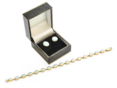 Lot 53 - A 9 Carat Gold Opal Bracelet, sixteen chain...