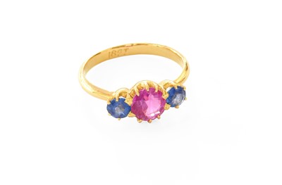 Lot 427 - A Synthetic Sapphire Dress Ring, the round cut...