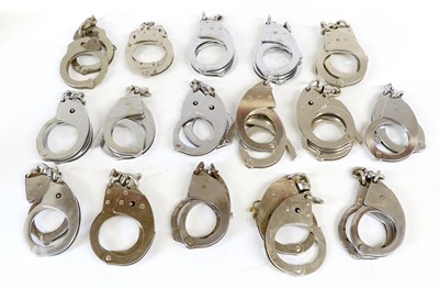 Lot 125 - Fourteen Pairs of Hiatt 1960 Handcuffs, with...