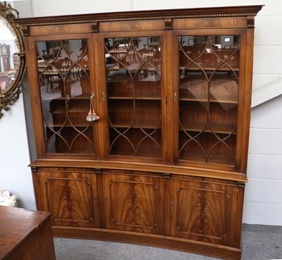 Lot 1281 - A Reproduction Mahogany Triple Bookcase, of...