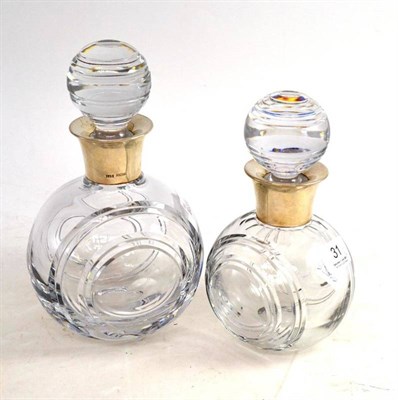 Lot 31 - Two silver mounted heavy glass decanters and stoppers