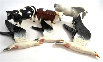 Lot 52 - A Beswick Hereford cow - 1360 and Friesian bull 1439A, a set of three seagulls, 992 (small, medium