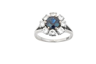 Lot 2236 - A Sapphire and Diamond Cluster Ring the round...