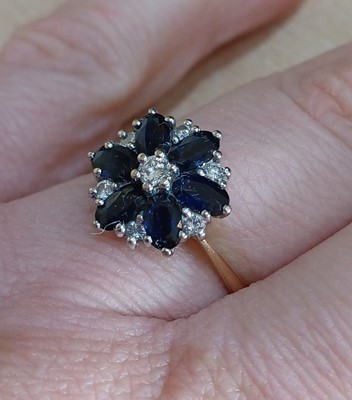 Lot 2163 - An 18 Carat Gold Sapphire and Diamond Cluster...