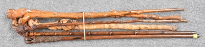 Lot 264 - A Collection of Six Carved Walking Sticks and...