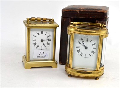 Lot 72 - A brass carriage timepiece and an oval brass carriage timepiece in an leather carrying case (2)
