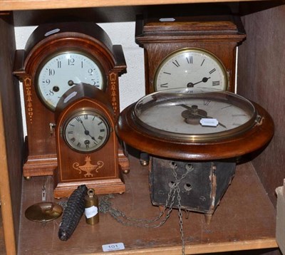 Lot 101 - Postman's alarum wall clock and three Edwardian mantel timepieces (4)