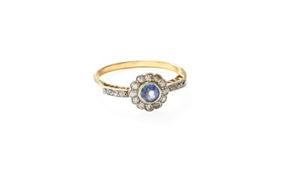 Lot 294 - A Sapphire and Diamond Cluster Ring, the round...