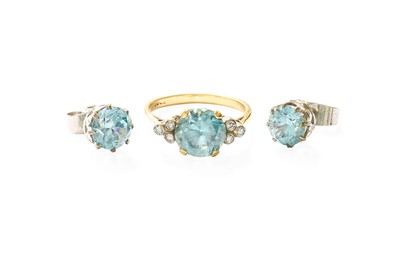 Lot 284 - A Blue Zircon and Diamond Ring, the round cut...