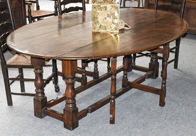 Lot 1177 - A 19th Century Oak Wake Table, on turned and...