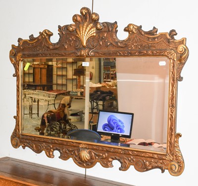 Lot 1172 - A Parcel-Gilt Reproduction Mirror, surmounted...