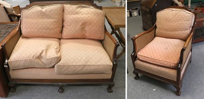 Lot 1176 - A 1920's Bergere Sofa, double caned and on...