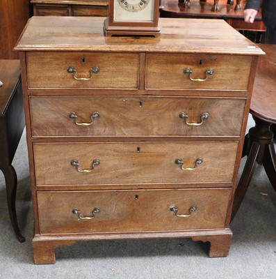 Lot 1315 - A George III Mahogany Chest, of two short over...