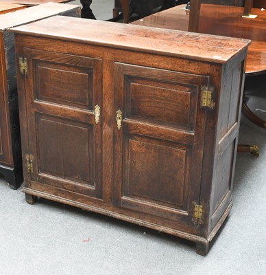 Lot 1304 - A 19th Century Oak Twin Panelled Door Cupboard,...