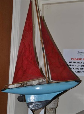 Lot 114 - A wooden pond yacht, with sails