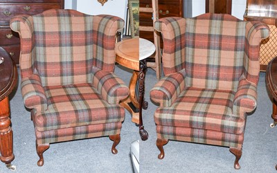 Lot 1320 - A Pair of Dalesbred Wing Back Armchairs in the...