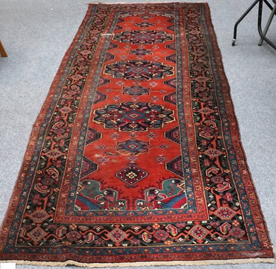 Lot 1101 - Azeri Long Rug, the rich terracotta field with...