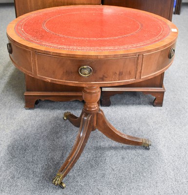 Lot 1144 - A Georgian Style Mahogany Drum Table, with red...