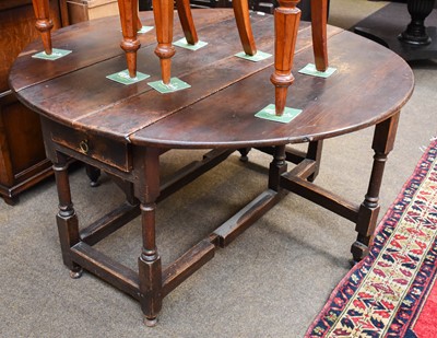 Lot 1252 - An Early 18th century Oak Gateleg Table, twin...