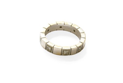 Lot 410 - A Diamond Eternity Ring, eight round brilliant...