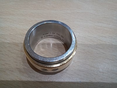 Lot 2187 - A Bi-Colour 'Santos' Ring, by Cartier the...