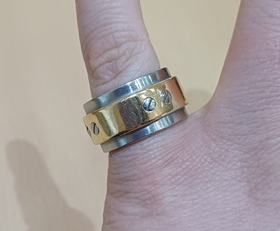 Lot 2187 - A Bi-Colour 'Santos' Ring, by Cartier the...