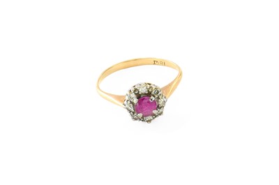 Lot 431 - A Ruby and Diamond Cluster Ring, the round cut...