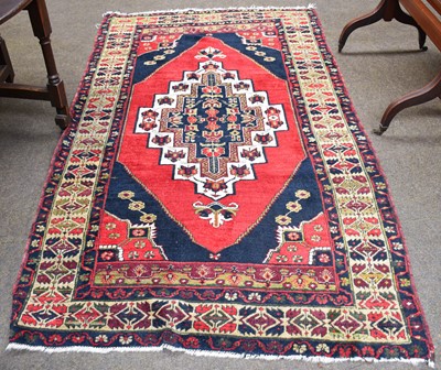 Lot 1100 - Anatolian Rug, the blood red lozenge field...