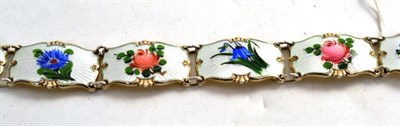 Lot 179 - A Norwegian silver gilt and enamel bracelet decorated with bluebells, roses and other flowers