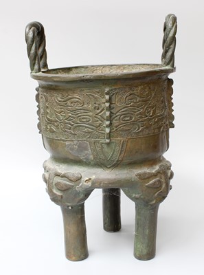 Lot 298 - A Chinese Bronze Tripod Censer, in archaic...