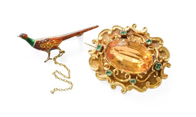 Lot 451 - A Citrine and Emerald Brooch, the oval cut...