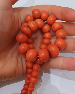 Lot 46 - A Graduated Coral Bead Necklace, length 42cm;...