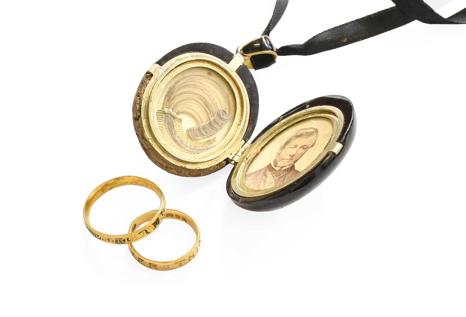 Lot 56 - A Jet Mourning Locket, the locket carved with...