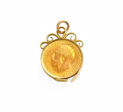 Lot 65 - A Sovereign Charm, dated 1913, enclosed within...