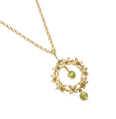 Lot 468 - A 9 Carat Gold Peridot and Split Pearl Pendant...