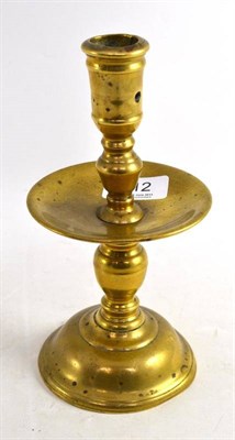 Lot 212 - An early brass candlestick