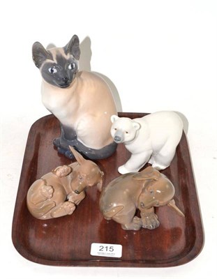 Lot 215 - A Royal Copenhagen figure of a Siamese cat, two royal Copenhagen figures of puppies and a...