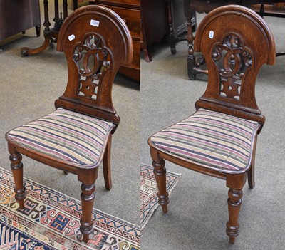 Lot 1268 - A Pair of Late 19th century Oak Hall Chairs,...