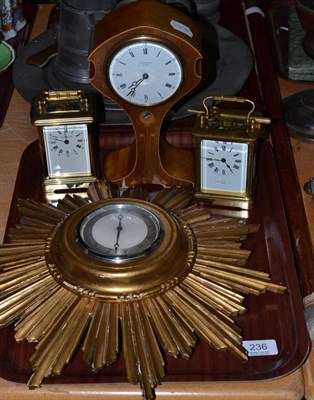 Lot 236 - An Edwardian inlaid mahogany mantel timepiece; a gilt wood sunburst wall timepiece and two...