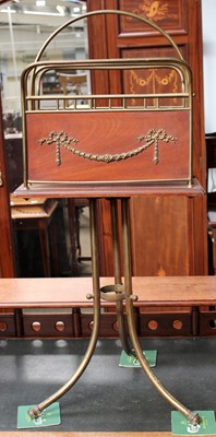 Lot 1200 - An Early 20th century Gilt Metal Magazine Rack,...