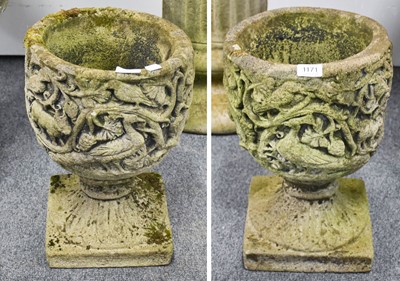 Lot 1171 - A Pair of Composite Garden Urns, decorated in...