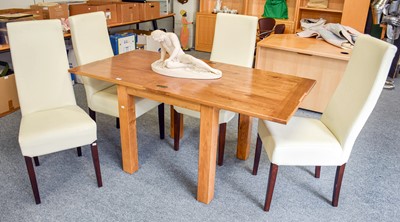 Lot 1142 - A Contemporary Light Oak Folding Dining Table,...