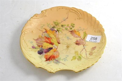 Lot 258 - A Royal Worcester plate decorated with berried branches and a spider and web, 22cm