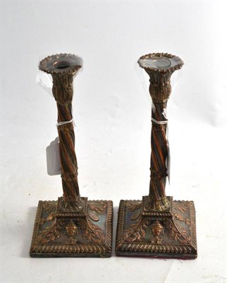 Lot 259 - Pair of plate on copper candlesticks