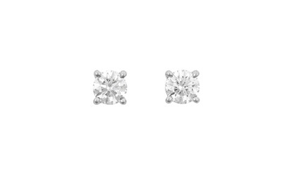 Lot 2243 - A Pair of Platinum Diamond Solitaire Earrings,...